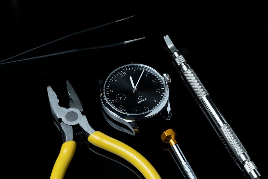A sleek wristwatch surrounded by watchmaking tools on a glossy black surface, showcasing precision in craftsmanship.